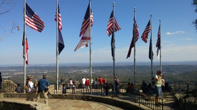 See 7 states with an American and state flag for each one